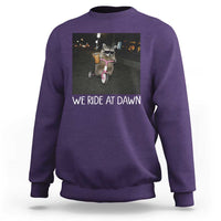 We Ride at Dawn Sweatshirt Funny Racoon Riding Tricycle Chaotic Meme