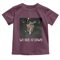 We Ride at Dawn Toddler T Shirt Funny Racoon Riding Tricycle Chaotic Meme