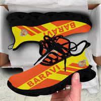 Clunky sneakers with Baravi flag graphic, orange/yellow print, black laces, black outsole