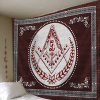 Close view of maroon tapestry with red Freemasonry diamond emblem, white circular border