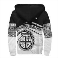 Black hoodie back with Polynesian crest, tribal banding, and patterned sleeves