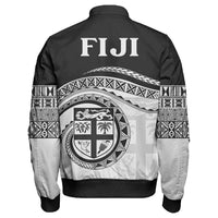 Black zip bomber jacket back: large FIJI text, crest emblem, Polynesian sleeve pattern