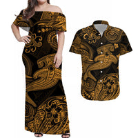 Off-shoulder black maxi dress with gold tropical scroll pattern, short sleeves