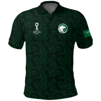 Dark green polo shirt with palm leaf pattern, front collar and Qatar 2022 logo