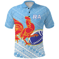 Blue rugby polo shirt with tapa pattern, RA logo and rooster graphic on front