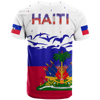 White T-shirt back with bold HAITI text, small figures, and flag sleeve panels