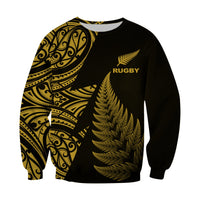 Unisex rugby sweatshirt with crew neck, black base, gold fern graphic and RUGBY text