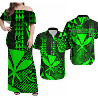 Green and black off-shoulder maxi dress with bold tropical pattern, short sleeves