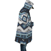 Blue geometric AOP cloak with attached hood and drawstring, side view, knee length