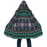 Close-up hooded cloak, neon tribal geometric print with triangular motifs in green and purple