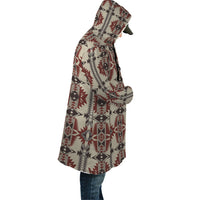 Geometric hooded cloak draped from shoulder, multicolor Aztec-style seamless print