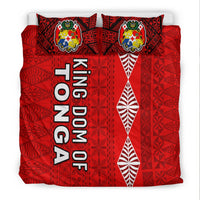 Red bedding set with crest pillows, 'KINGDOM OF TONGA' text, white leaf motif