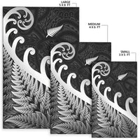 Black rug set with koru and fern motifs in small 3x5, medium 4x6, large 5x8