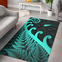 Turquoise and dark green Maori koru and fern area rug, bordered geometric pattern