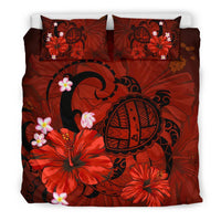 Red duvet cover with large turtle emblem, hibiscus flowers, plumeria blossoms; two pillows