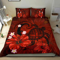 Red bedding with oversized hibiscus and turtle mandala print; two matching pillowcases
