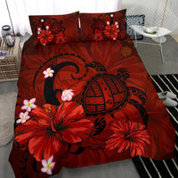 Red duvet cover with turtle emblem, hibiscus and plumeria flowers; two matching pillows