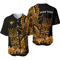 Black baseball jersey with gold tiki mask print and tropical floral hem