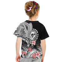 Black graphic T-shirt back with tribal crest, hibiscus flowers, and patterned fan leaves