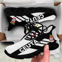 Black clunky sneakers with CEUTA stripe print and emblem details, close-up