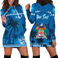 Blue hoodie dress with palm tree and tapa-style pattern, front graphic and hood