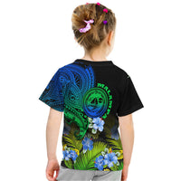 Gradient graphic kids T-shirt with back emblem, blue-green tribal designs, and hibiscus flowers