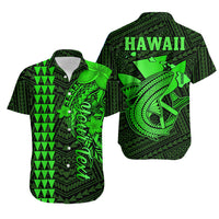 Green short-sleeve Hawaiian shirt with button front and bold tiki-style fish print