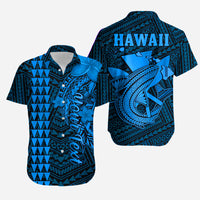 Blue Hawaiian button-up shirt with 'HAWAII' on back and hibiscus/tropical motifs