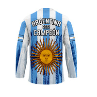 White and light blue striped hockey jersey with back print 'CAMPEÓN 2022' and sun emblem