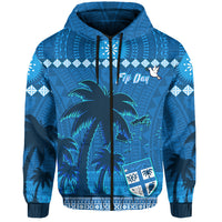 Blue pullover hoodie with drawstring hood, tropical palms, and shield crest graphic