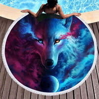 Round beach towel with blue and purple wolf face artwork, white border trim
