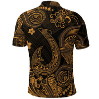 Back black polo shirt with gold polynesian fish hook motif and fan, tiki, flower designs