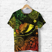 Black Polynesian-style T-shirt with colorful humuhumu fish, floral motifs, and swirl patterns