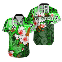 Green hawaiian shirt with hibiscus flowers and black hammerhead shark pattern, button-front collar