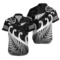 Black Hawaiian-style button-up shirt with white fern and leaf graphic print