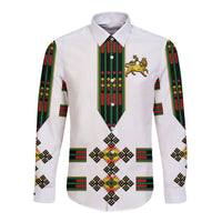 White long-sleeve button shirt with green/red vertical trim and gold lion crest