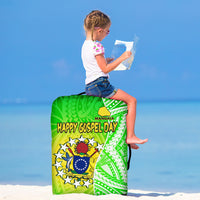 Green luggage cover with 'Happy Gospel Day' lettering and geometric island pattern