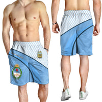 Bermudas celeste y blancas con banda diagonal y escudo AFA, cintura elástica