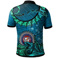 Blue custom polo shirt back view with large tribal graphic and centered round school crest