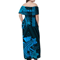 Back view of blue off-shoulder maxi dress with 'HAWAII' text and tropical shark print