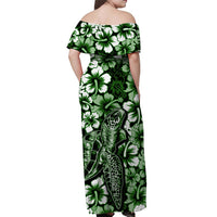 Green off-shoulder maxi dress, back view, turtle artwork with hibiscus-style florals