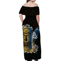 Off-shoulder maxi dress, black base with tiki faces and blue floral accents