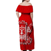 Red off-shoulder maxi dress, back view; tiki and hibiscus floral panel print