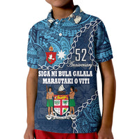 Blue polo shirt front close-up: 52 Anniversary text and crest on button placket