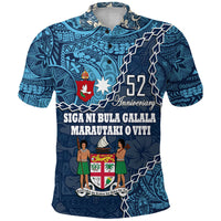 Blue 52nd anniversary Fiji polo shirt with colorful crest graphic and floral patterns