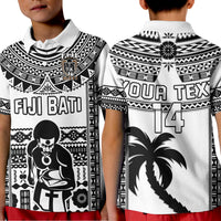 Kids rugby polo shirt front close-up, black-and-white tribal print with 'FIJI BATI' and figure