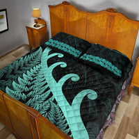 Turquoise-accent quilt bed set with fern pattern, koru motif, and two pillowcases