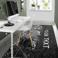 Black Viking runes rug with white Odin figure, in office corner