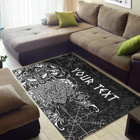 Black area rug with Odin rune pattern and white Viking figure, on living-room floor
