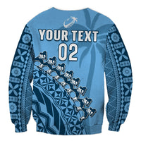 Blue unisex rugby sweatshirt with YOUR TEXT and number 02, tapa-inspired geometric print